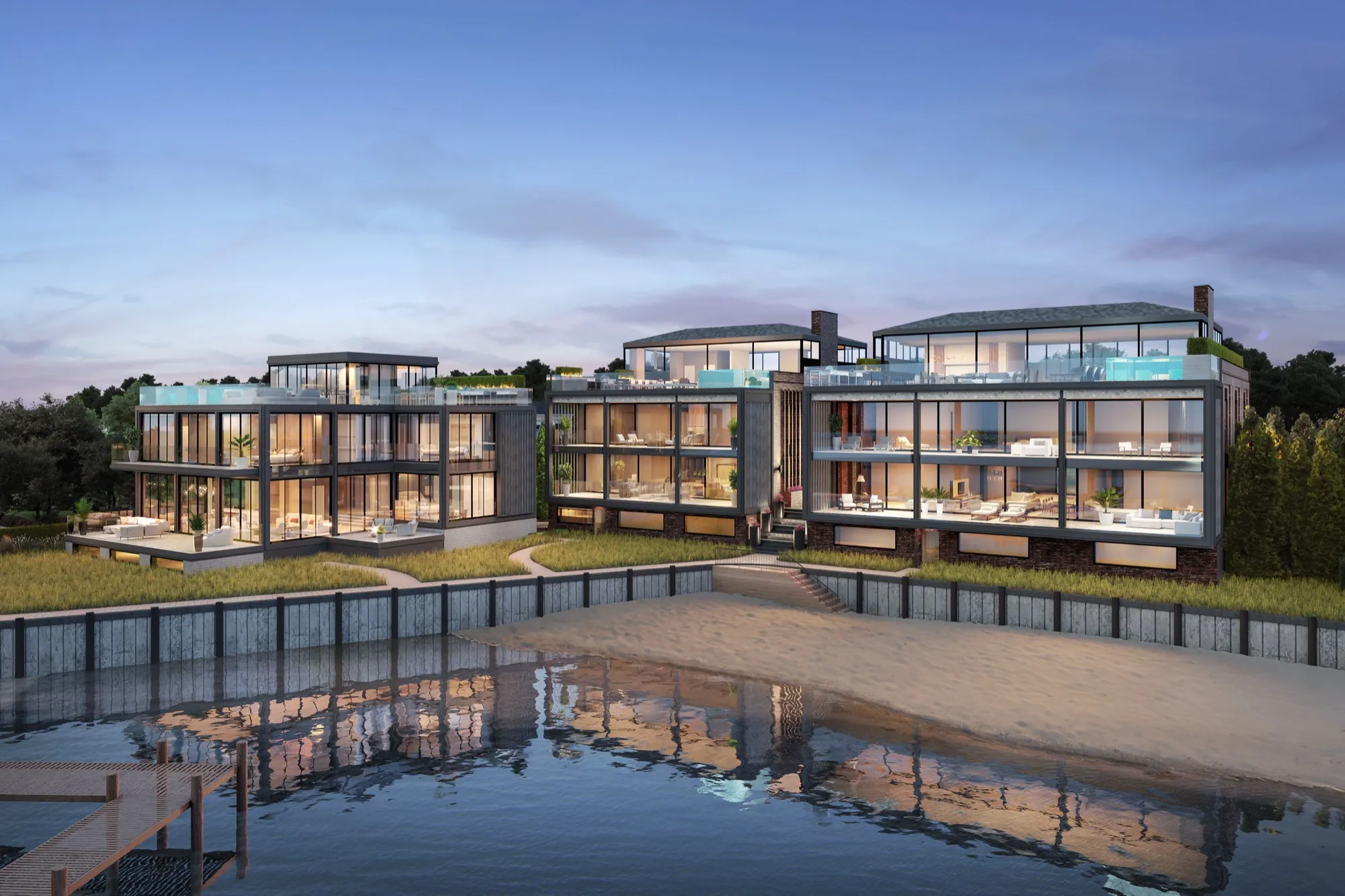 Dusk 3D rendering of the three residences at 2 West Water Street seen from Sag Harbor Cove, their glass facades and rooftop pools lit above a sandy beach and a timber dock.