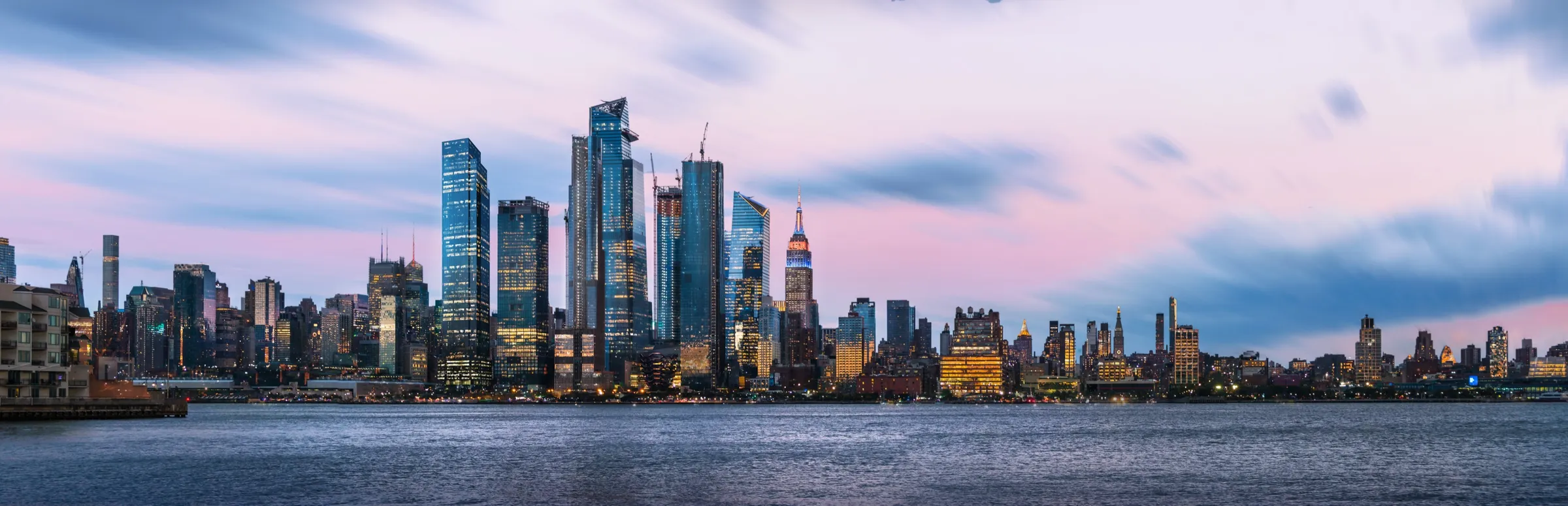 Panoramic 3D rendering by NoTriangle Studio of the Manhattan skyline at dusk seen across the Hudson River, with an early concept of 3 Hudson Boulevard among the Hudson Yards towers and the Empire State Building to the right.