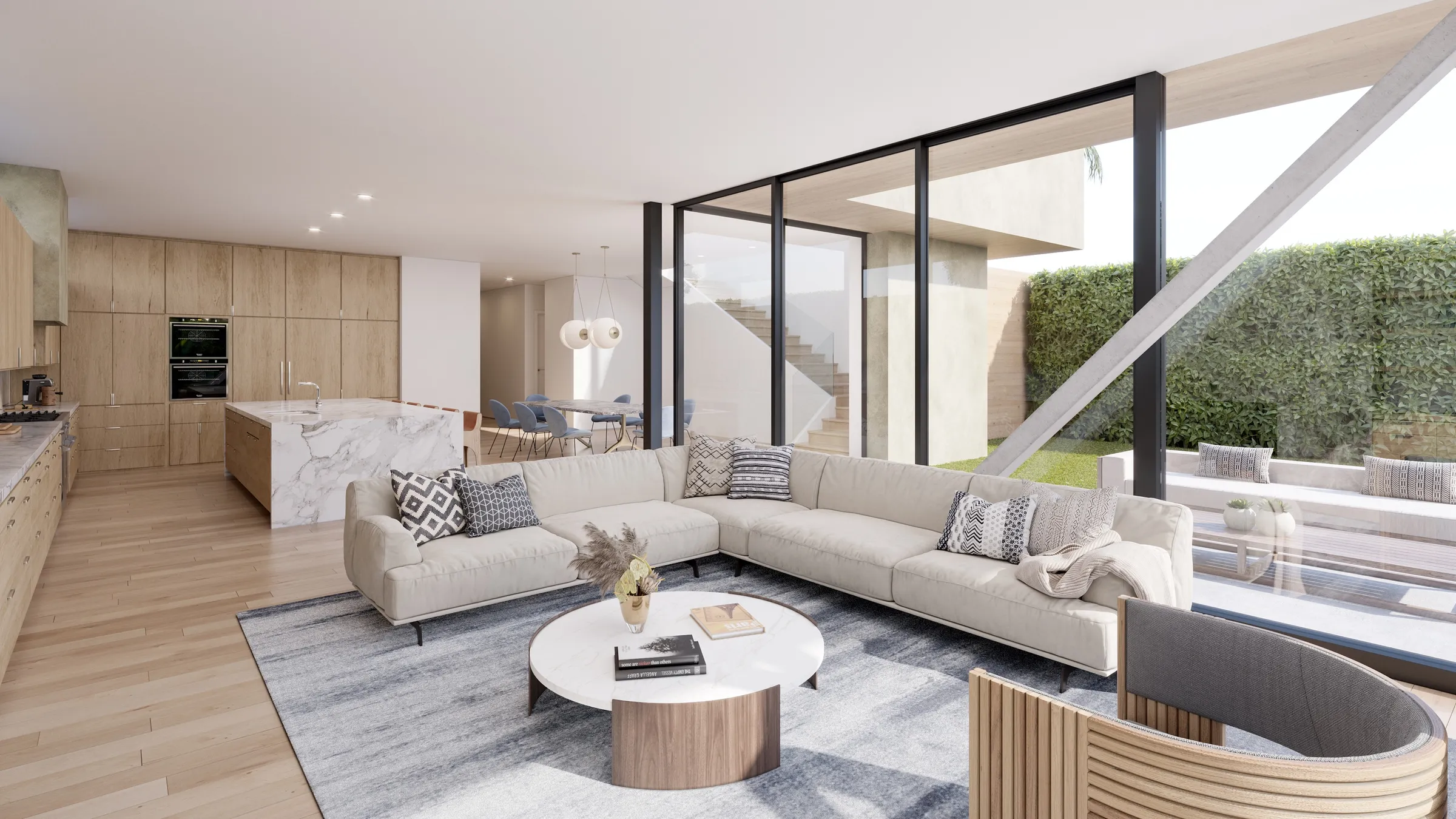 Photorealistic 3D rendering by NoTriangle Studio of the living room at 3140 Grand View Boulevard, Mar Vista: a pale sectional sofa and round coffee table in front of a glass wall to the garden, with the marble kitchen island behind.