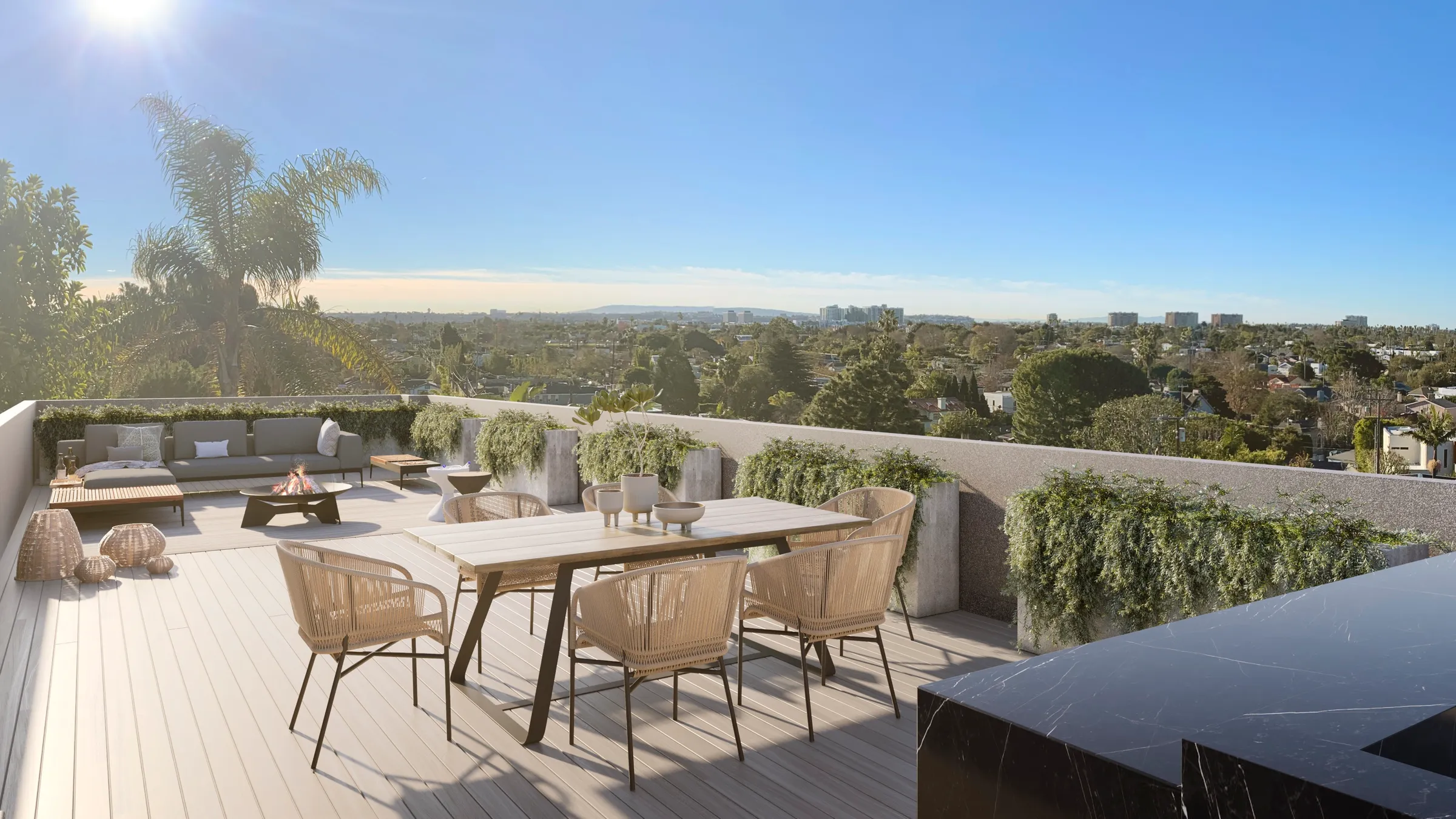 Photorealistic 3D rendering by NoTriangle Studio of the roof deck at 3400 Greenwood Avenue, Mar Vista: a dining table with woven chairs, planters and a lounge area, looking west over tree-lined streets toward the horizon.
