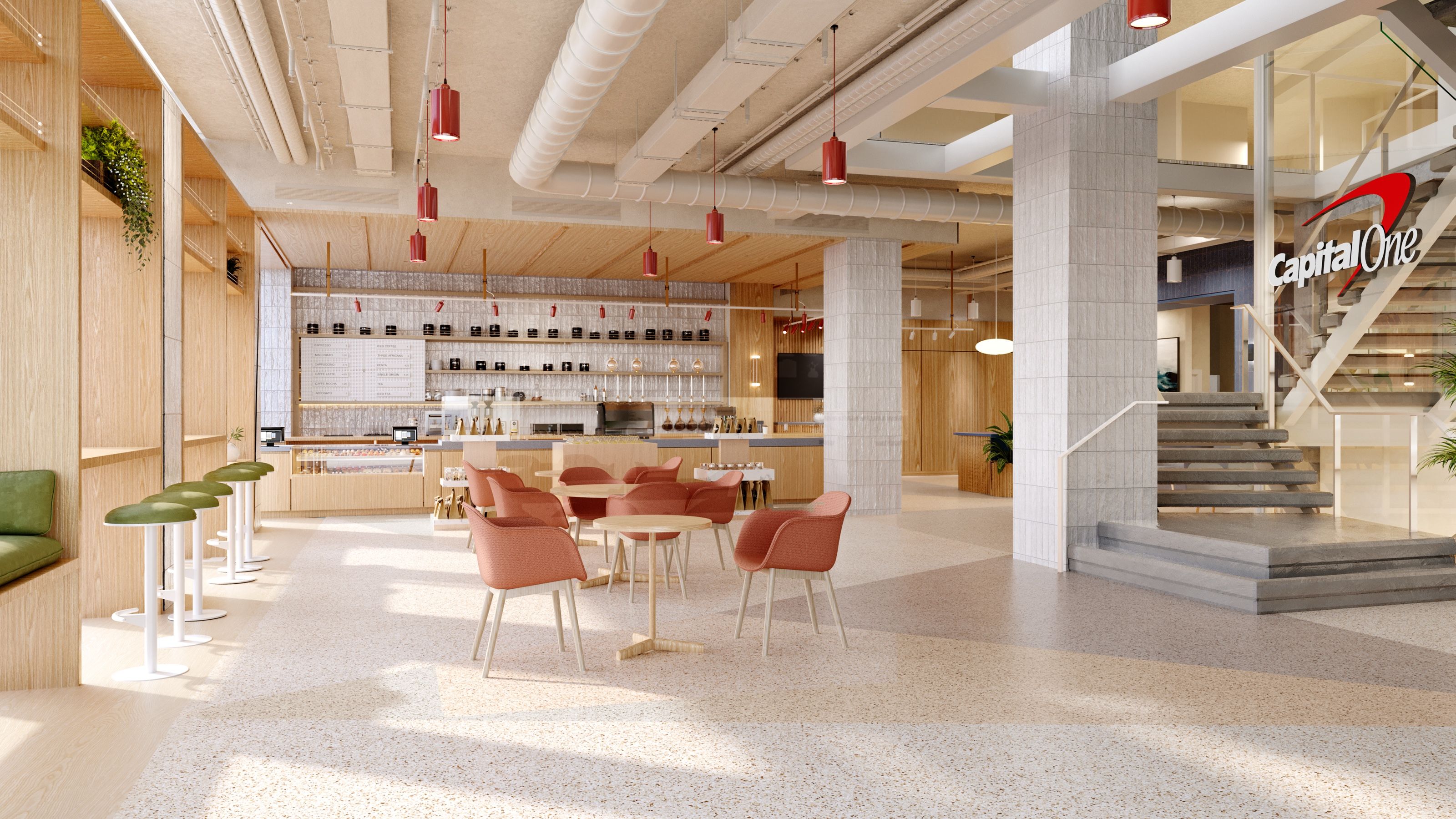 3D interior rendering of the Capital One Café at Union Square in Manhattan, with a coffee bar lit by red pendant lights, coral tub chairs, exposed ceiling ductwork, a terrazzo floor, and the Capital One logo beside a staircase.