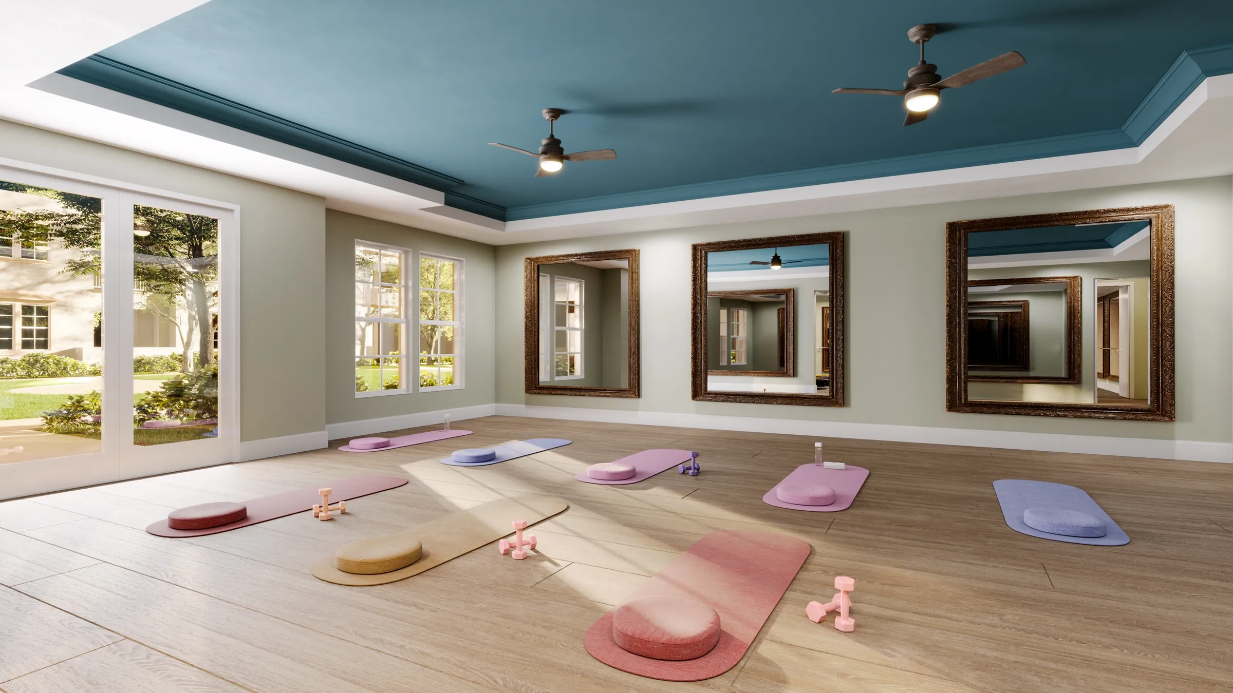 Interior 3D rendering of the yoga studio at Anindell in Folsom, California, a light-filled room with wood floors, colorful yoga mats and bolsters laid out, framed mirrors on a sage wall, ceiling fans, and garden views through the windows.