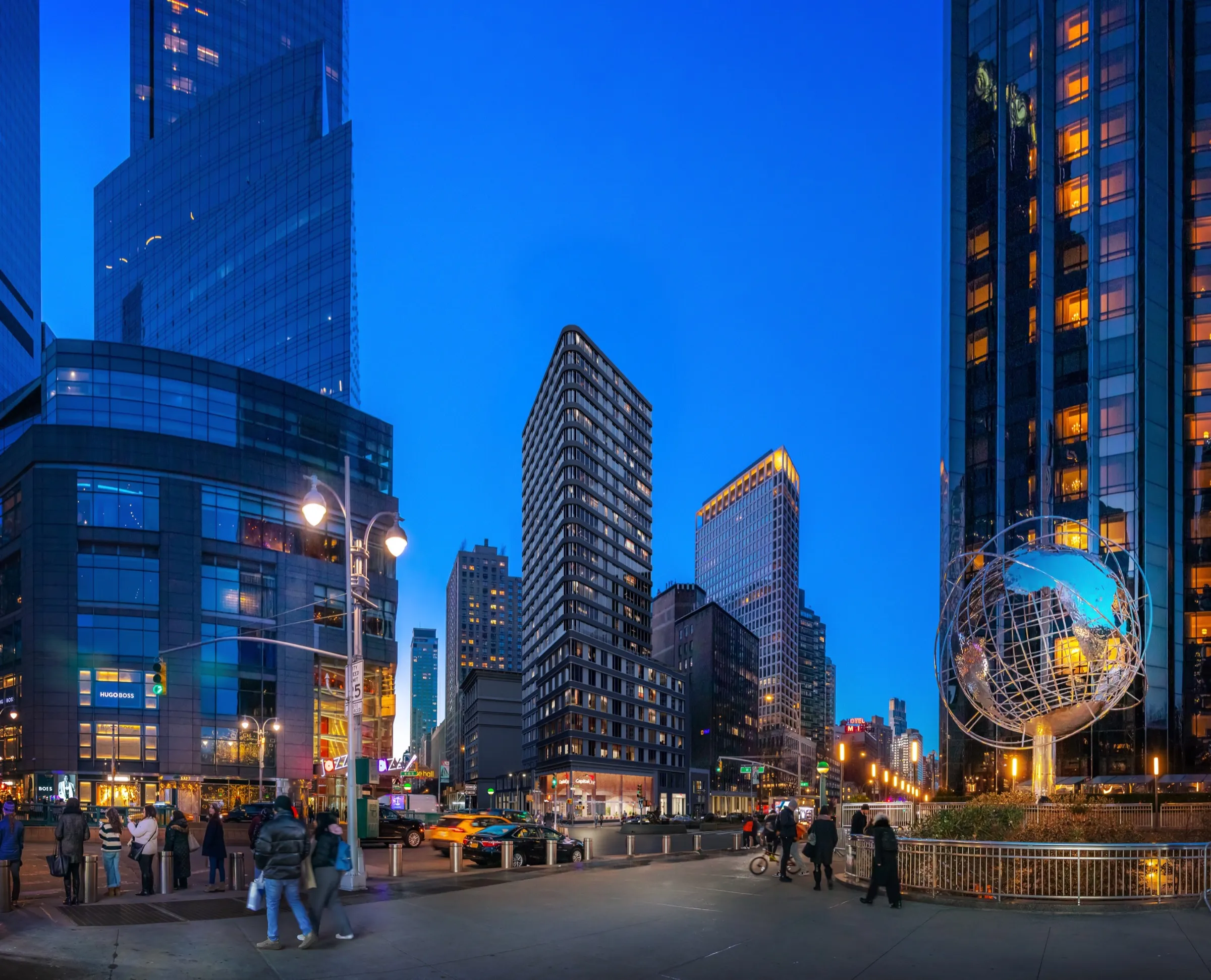 3D exterior context rendering of the same Capital One Café corner near Columbus Circle in Manhattan at night, with lit windows across the surrounding towers and the illuminated Columbus Circle globe sculpture.