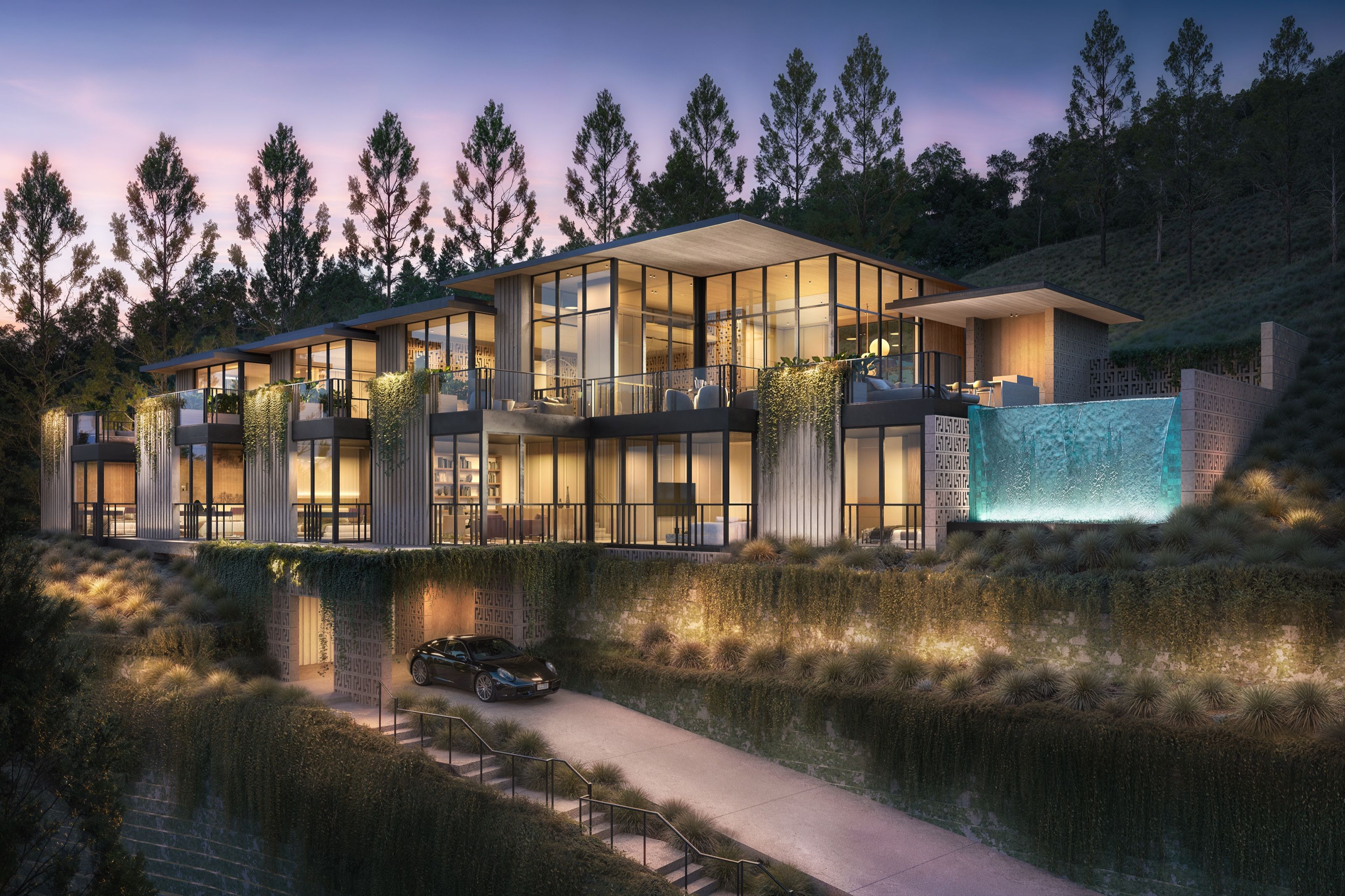 A photorealistic 3D architectural rendering by NoTriangle Studio showing House 1 of the Carrizo Lots development in La Jolla, California, at night, the glass-walled modern hillside home glowing with warm interior light above an illuminated turquoise waterfall feature and terraced landscaping.