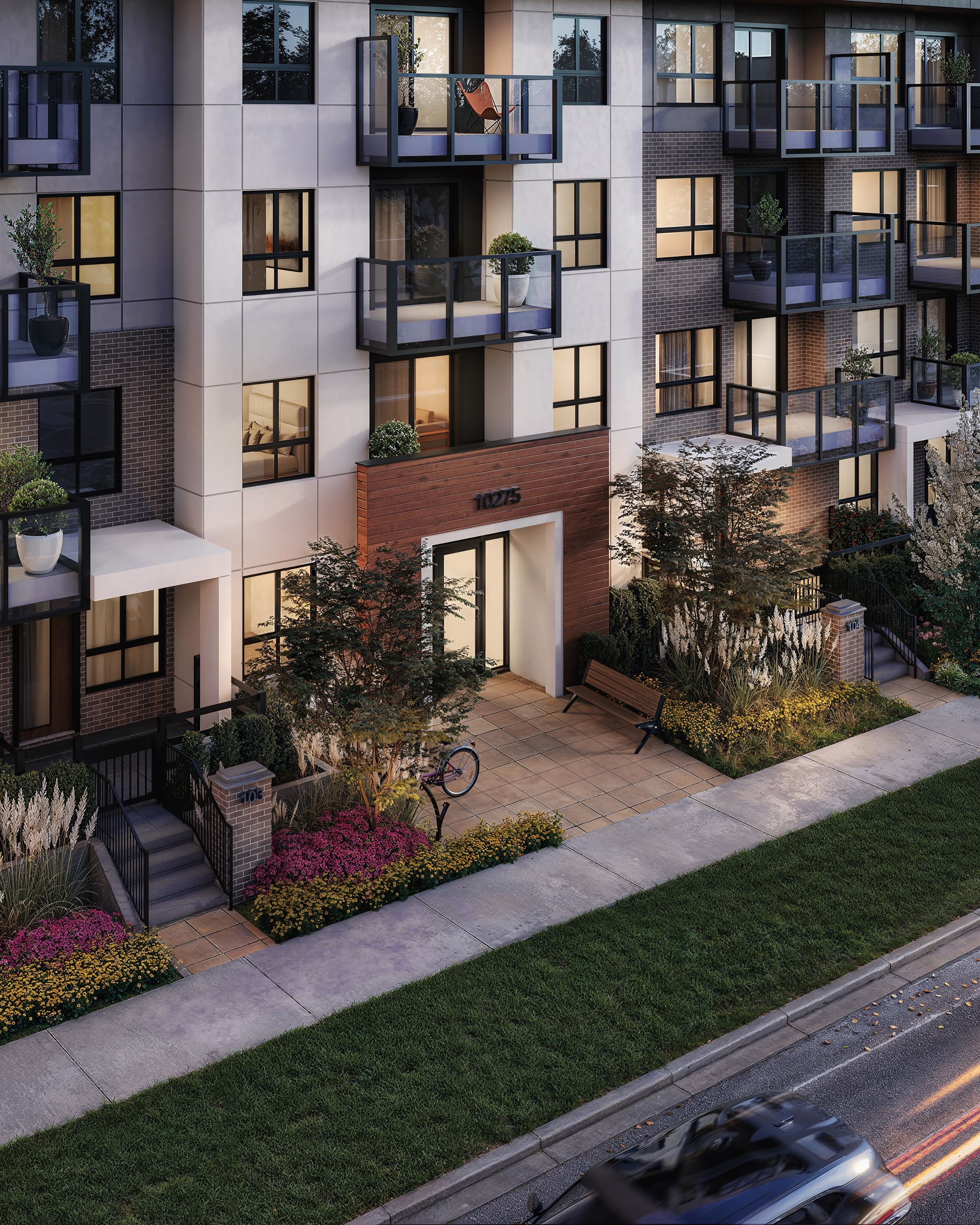 3D rendering of the Muse ground-floor entrance, with a brick base, townhouse-style stoops, layered planting, and glass balconies above.