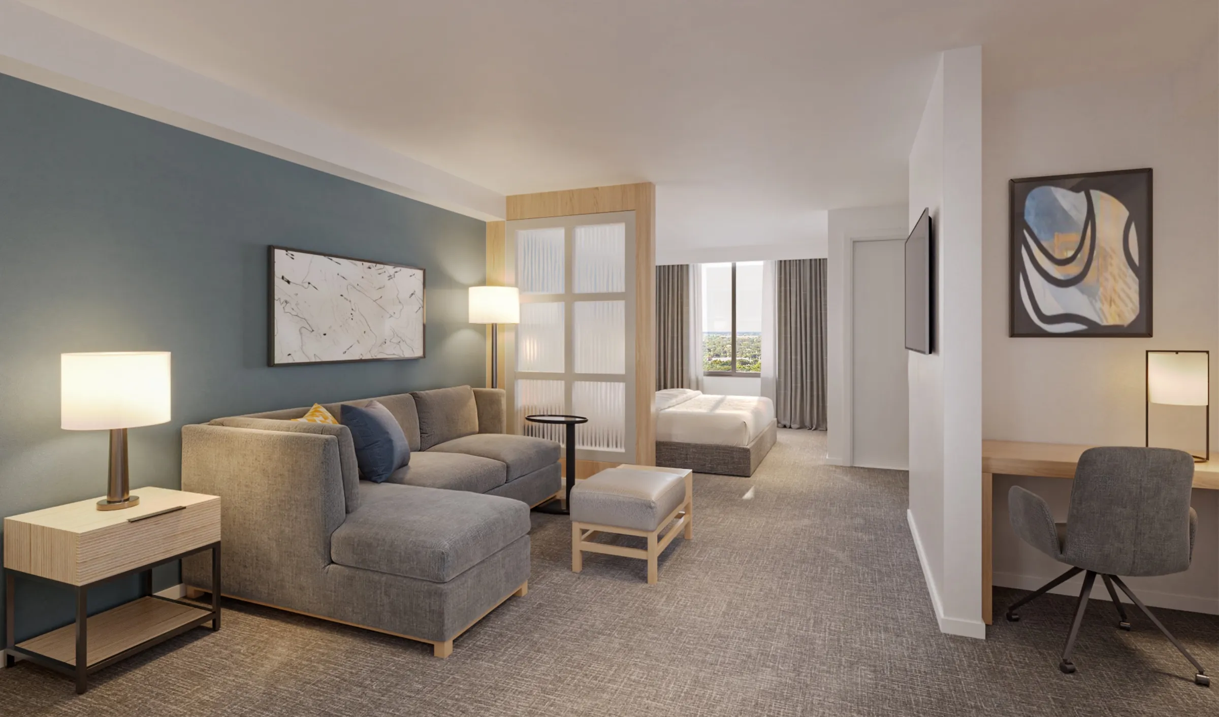 3D interior rendering of a renovated king guest room at Hyatt Place Bentonville/Rogers in Rogers, Arkansas, seen from beside the work desk, a grey sectional sofa and ottoman against a blue accent wall, a frosted-panel divider, and the bed and window beyond.