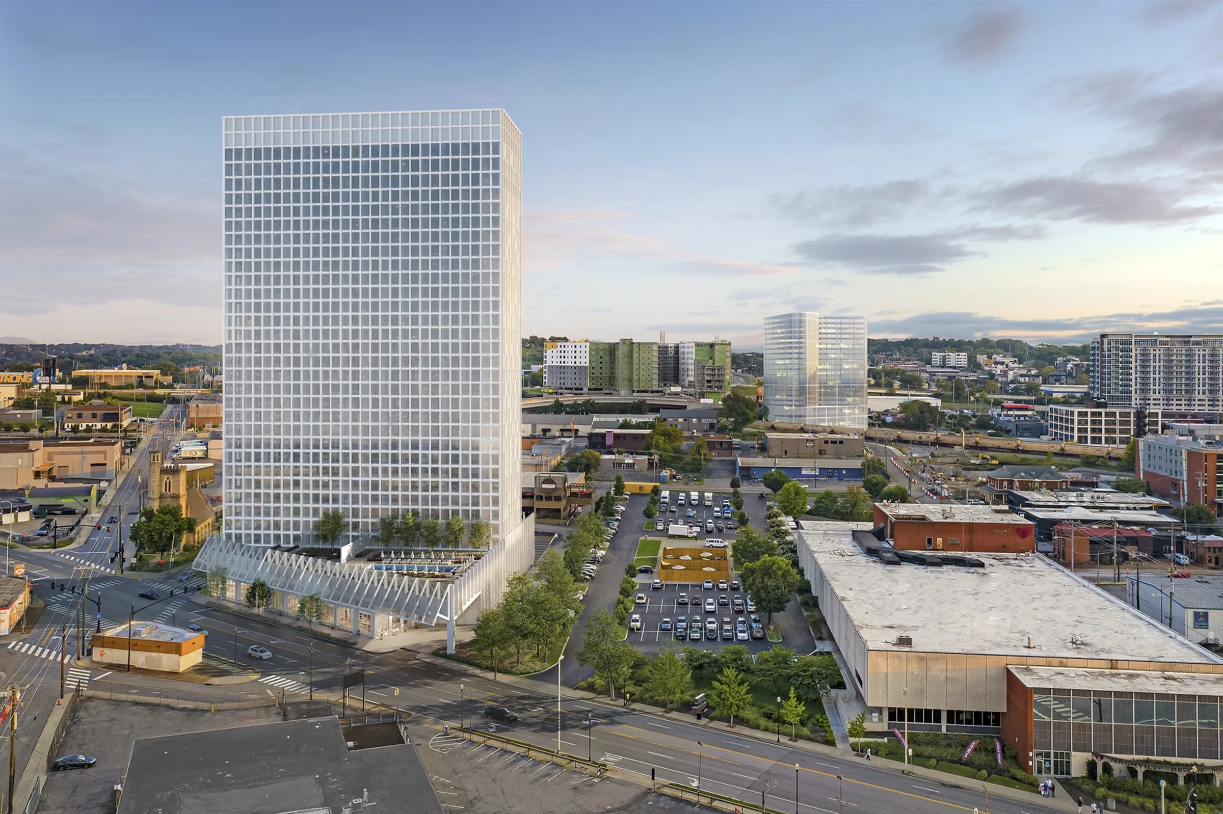 3D rendering of the Ray Nashville tower rising 32 stories over Pie Town, with its glass podium canopy and the downtown Nashville skyline behind