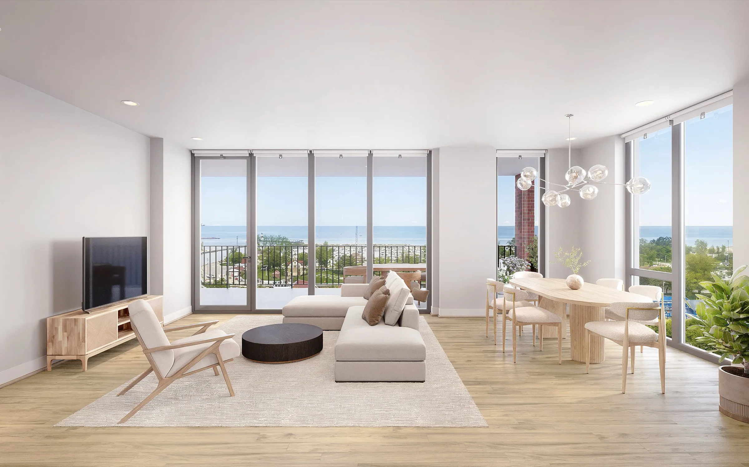 Photorealistic 3D rendering of the living and dining room of Residence 925 at SoLa in Michigan City, Indiana, with floor-to-ceiling windows overlooking Lake Michigan, a sectional sofa, a wall-mounted television, and a round dining table beneath a cluster chandelier.