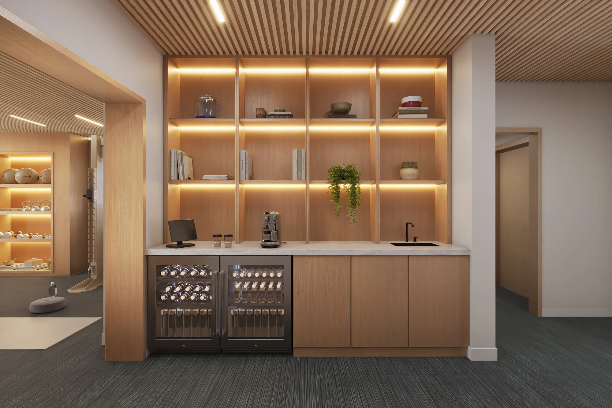 3D rendering of the coffee and refreshment bar at the Spring Street studio in Aspen, with a marble counter, backlit wood shelving, an espresso machine, and glass-front beverage fridges.