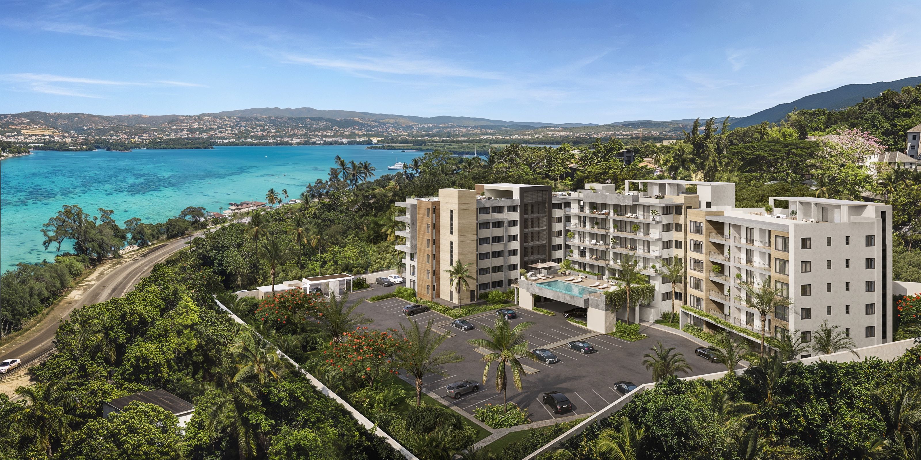 The Elysian Jamaica resort exterior rendering in daylight, looking across the development toward Montego Bay