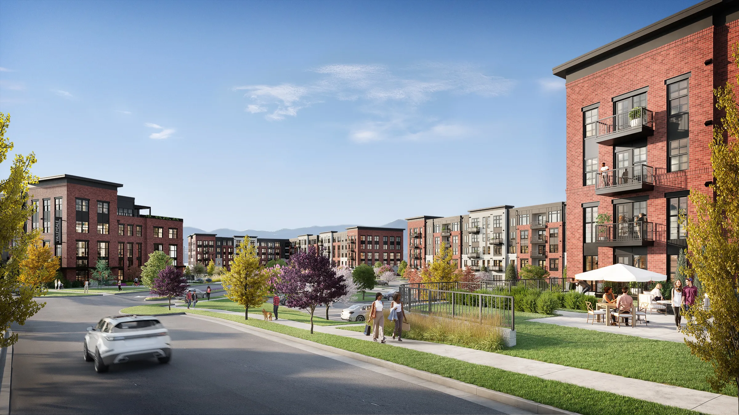 Street-level 3D rendering of Valleydale Apartments in Salem, Virginia, four-story red-brick and grey apartment buildings with black balconies along a tree-lined street, residents on a landscaped patio under an umbrella, and the Blue Ridge Mountains on the horizon.