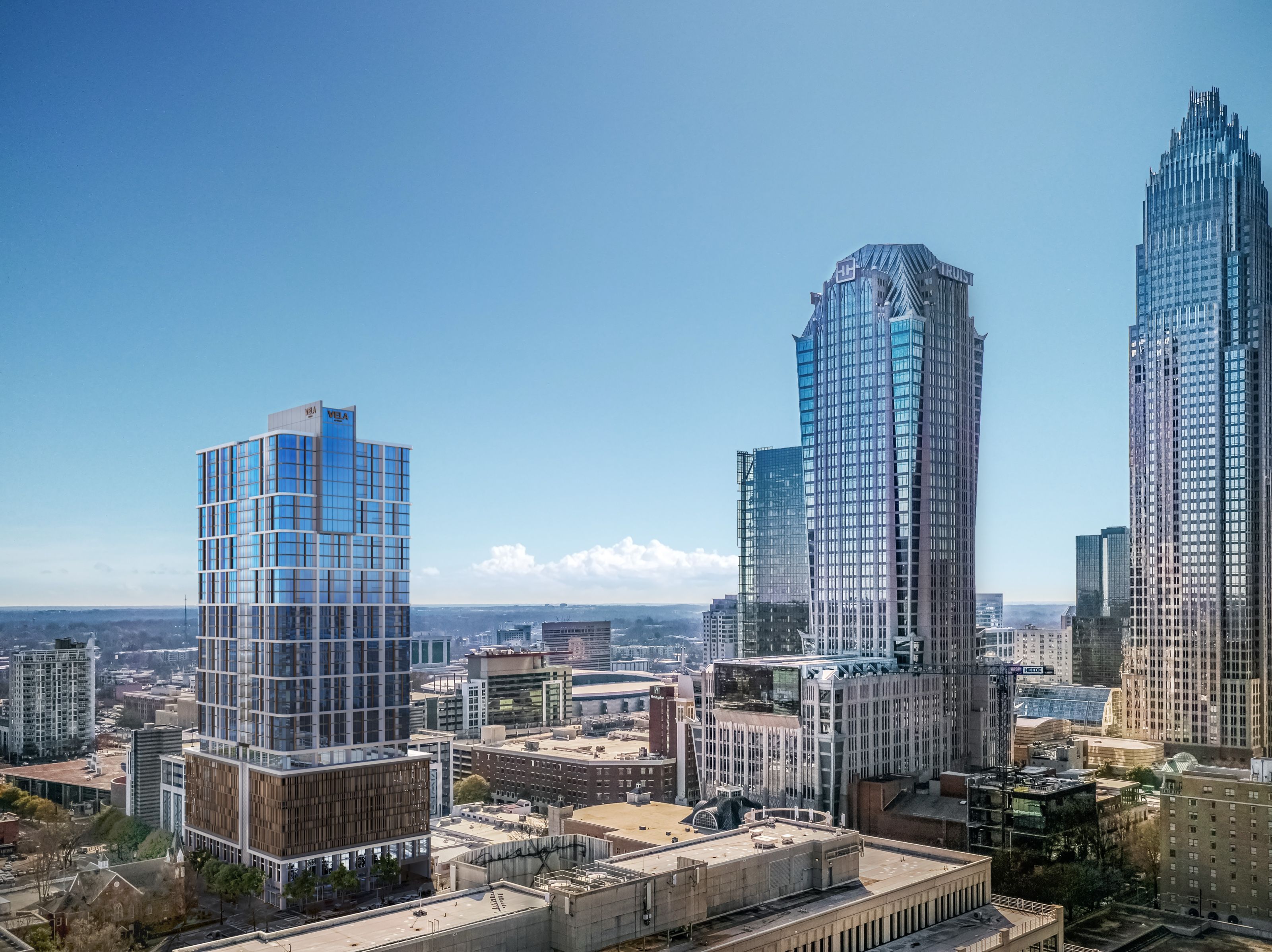Aerial 3D rendering of the 32-story VeLa Uptown tower in Charlotte, a blue glass tower set among the city's skyline towers by day.
