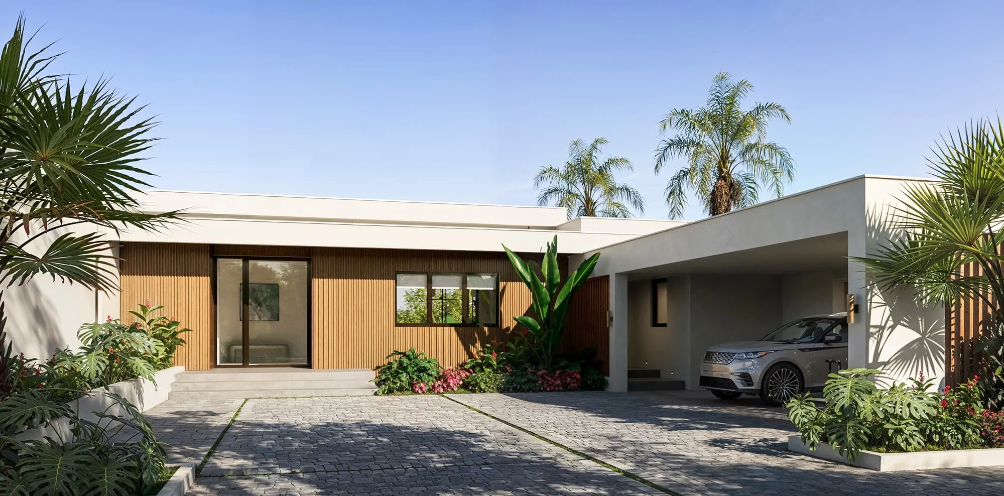 3D exterior rendering of the Villa Solene entrance elevation at Apes Hill, Barbados, showing the single-story home with vertical timber-slat cladding against white render, a glazed front door reached by low steps, a covered carport with a parked SUV, and a stone-paver driveway framed by palms and flowering tropical beds.