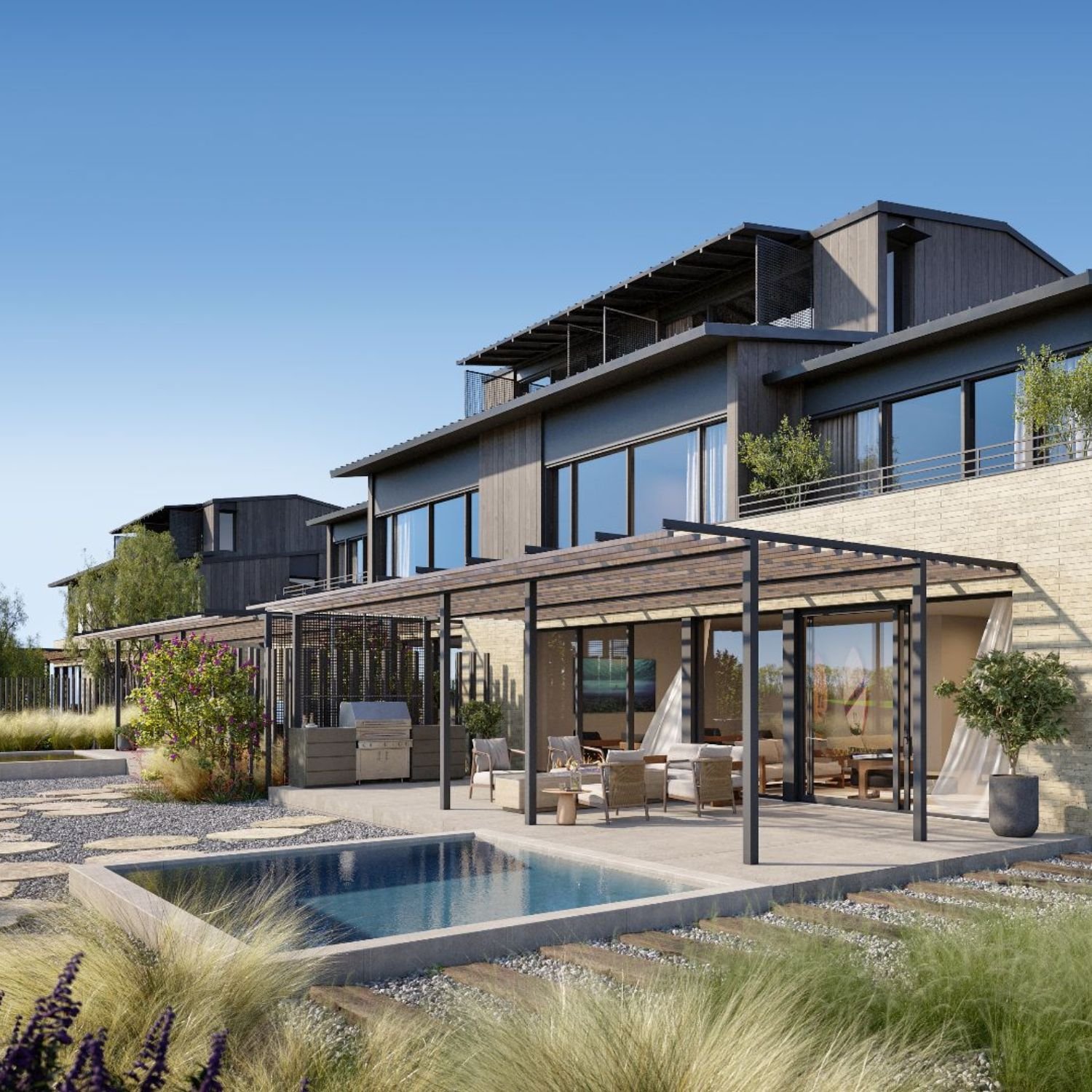 3D exterior rendering of an Austin Surf Club residence rear terrace, with a steel pergola over an outdoor lounge and kitchen, a plunge pool, native prairie grasses, and a row of timber homes stepping back beyond.