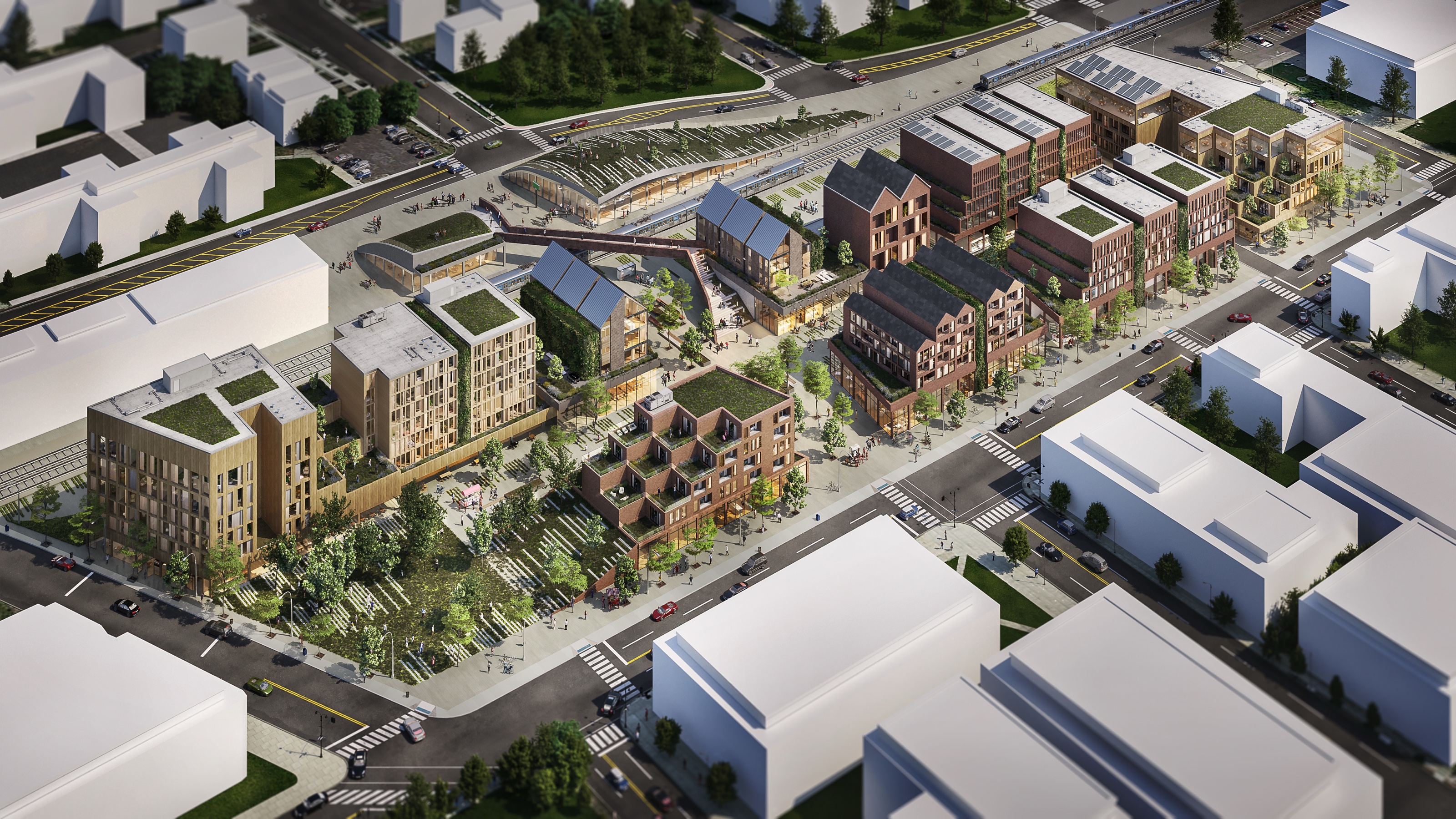 Aerial 3D rendering of the Asbury Park Transit Hub master-plan concept, a new district of gabled buildings and landscaped squares wrapping the rail line.