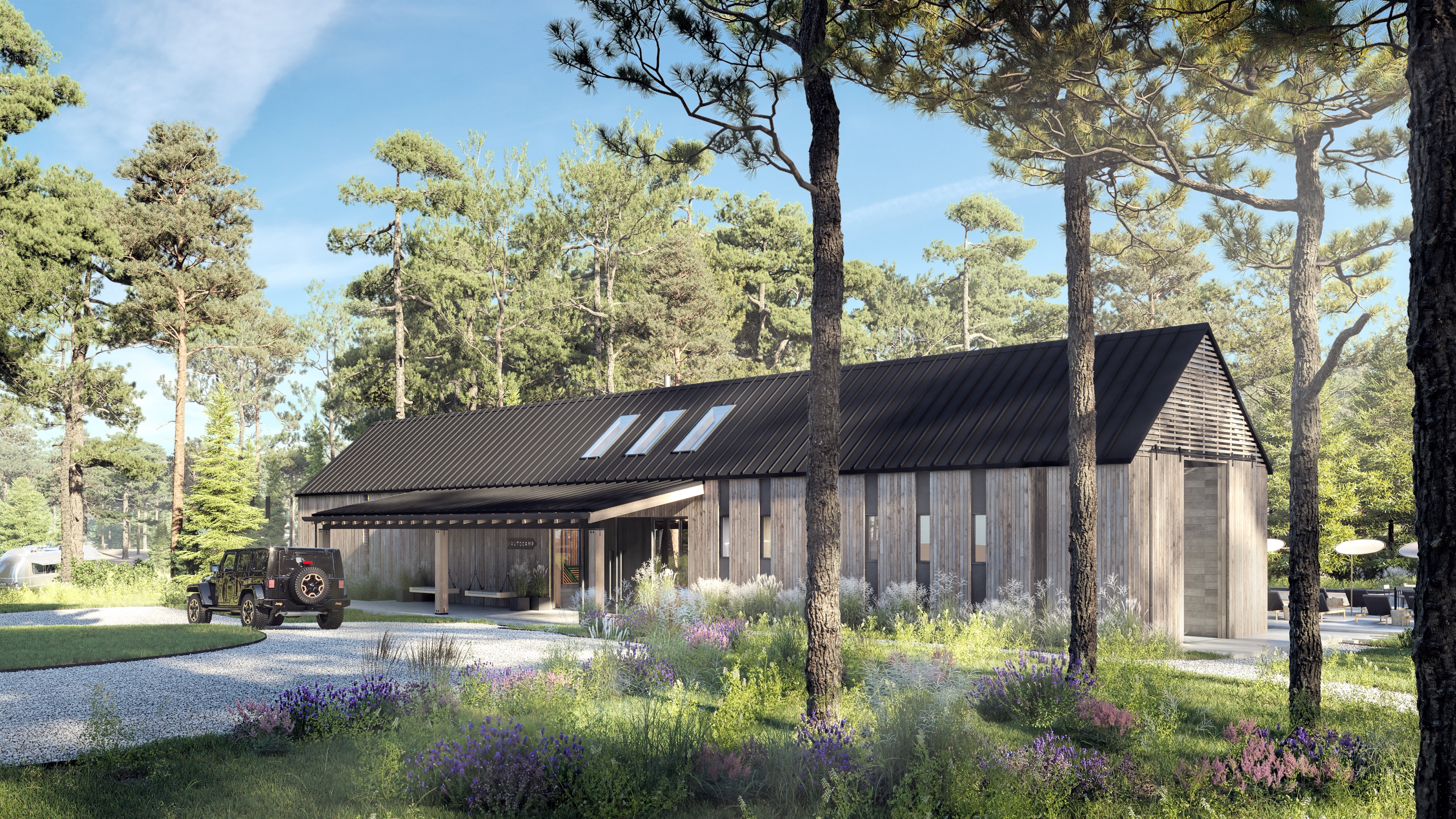 Daytime 3D rendering of the AutoCamp Catskills clubhouse, two gabled cedar-clad masses with dark standing-seam roofs and a covered entry, a Jeep on the gravel drive, set in a wildflower meadow among tall pines.