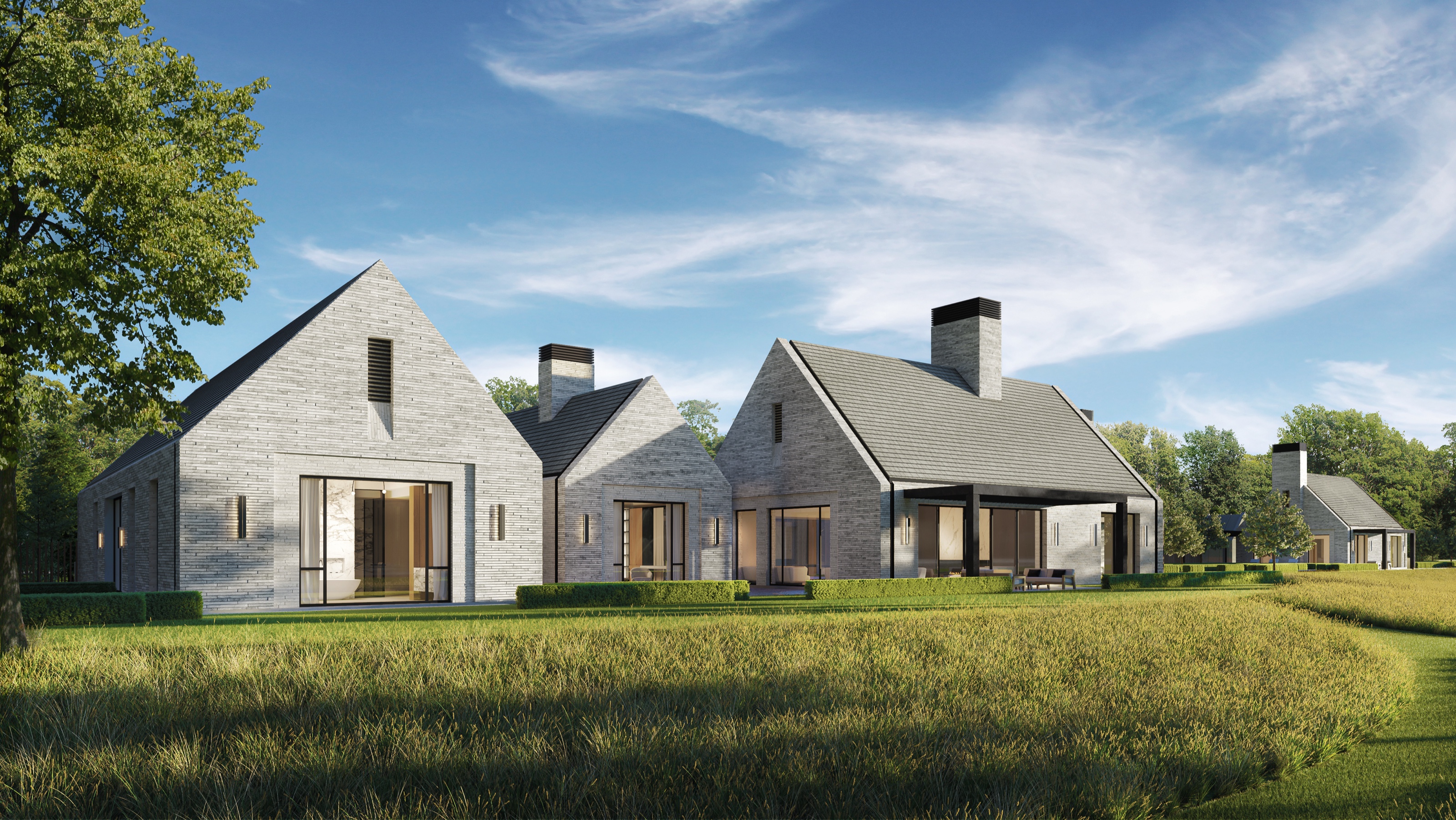 Daytime 3D rendering of the Greenwich compound's white-brick gabled volumes with dark roofs and a stone chimney, set above a meadow of long grass under a bright sky.