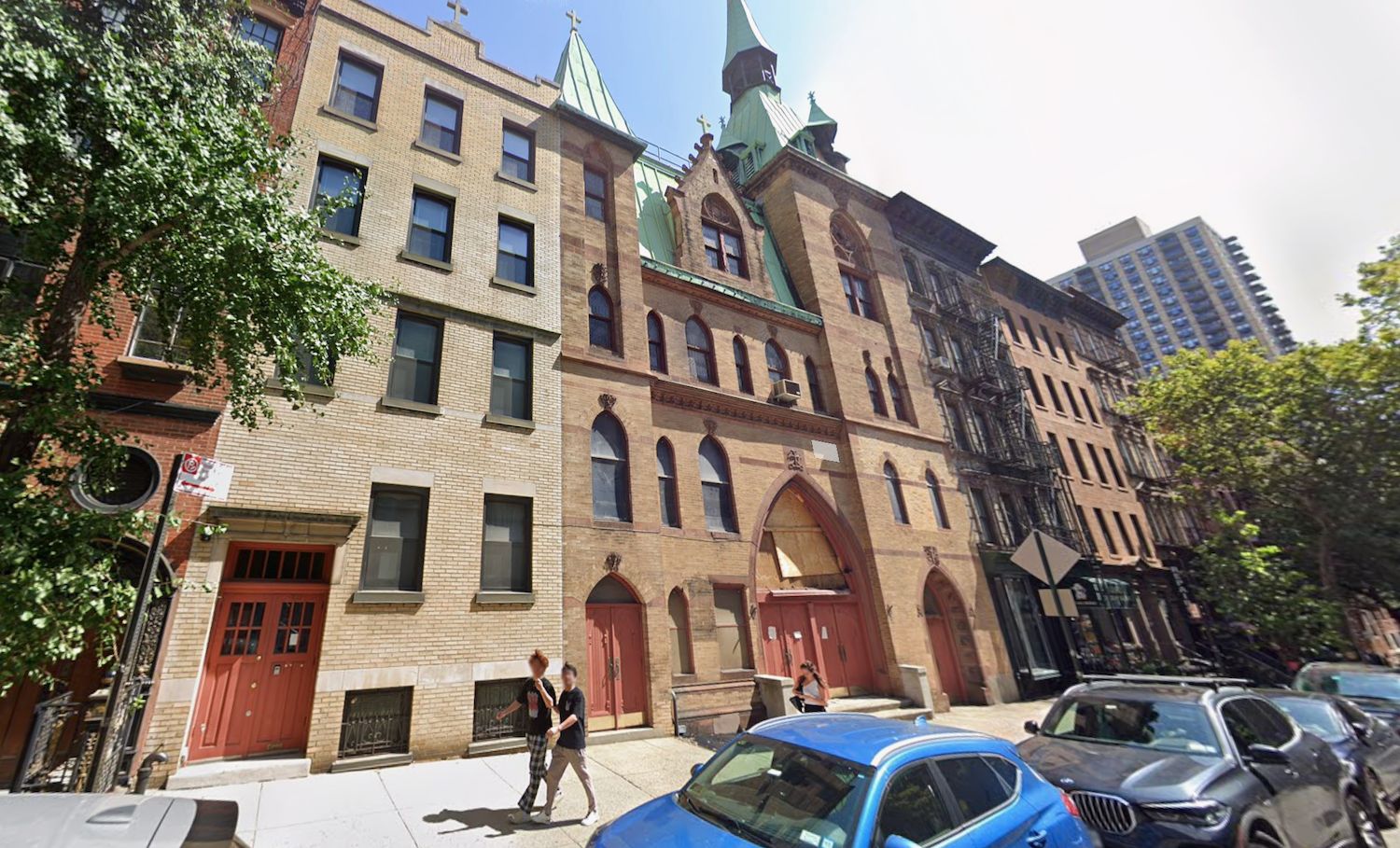 Street-view photograph of the existing site at 213 East 83rd Street, the former Church of St. Elizabeth of Hungary, a brick and stone building in Yorkville before redevelopment