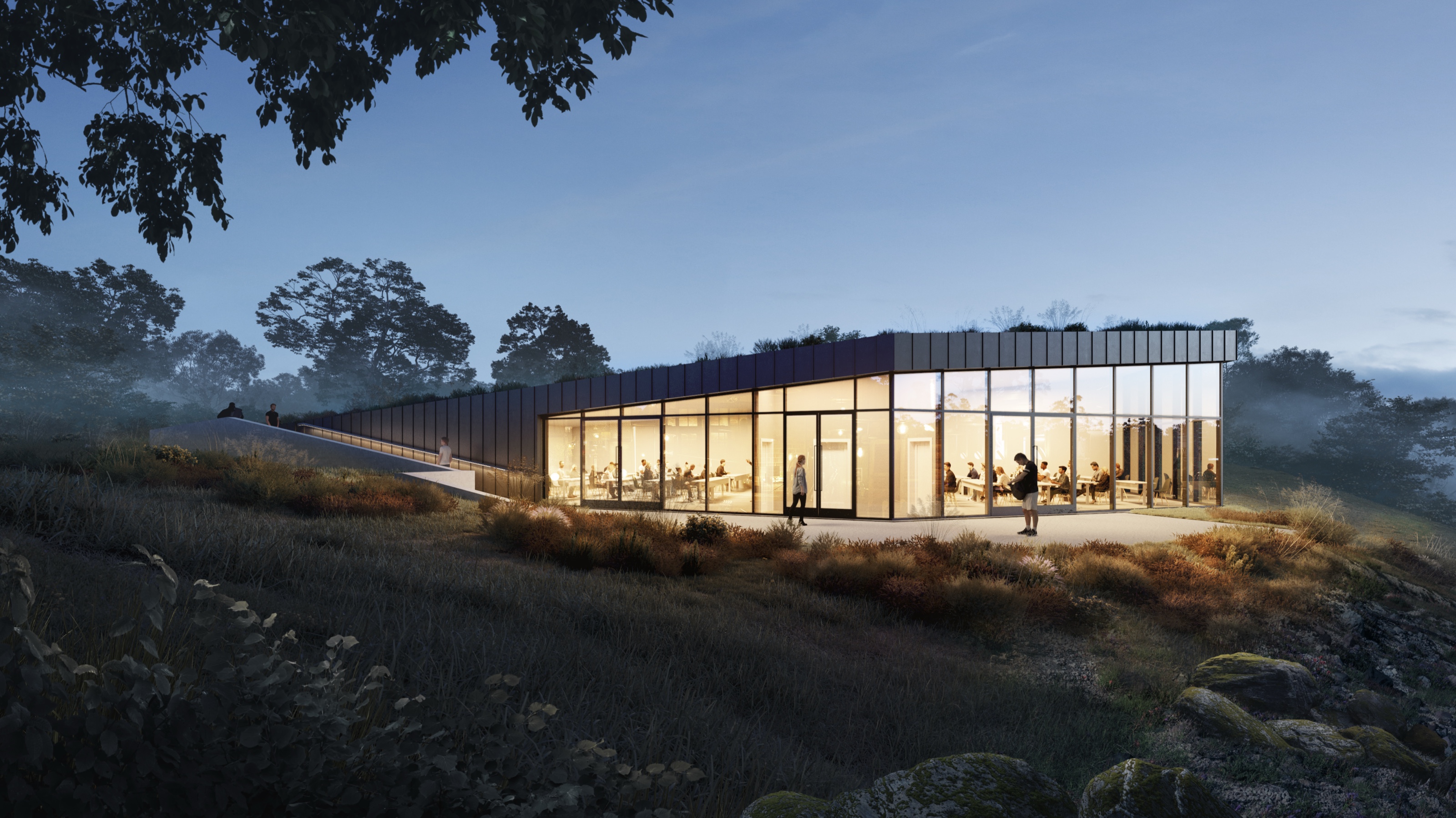 Dusk 3D rendering of the University of Health and Performance classroom building, a low glass-walled pavilion under a green roof glowing warm from within as people sit at tables inside, set in a misty meadow at blue hour.