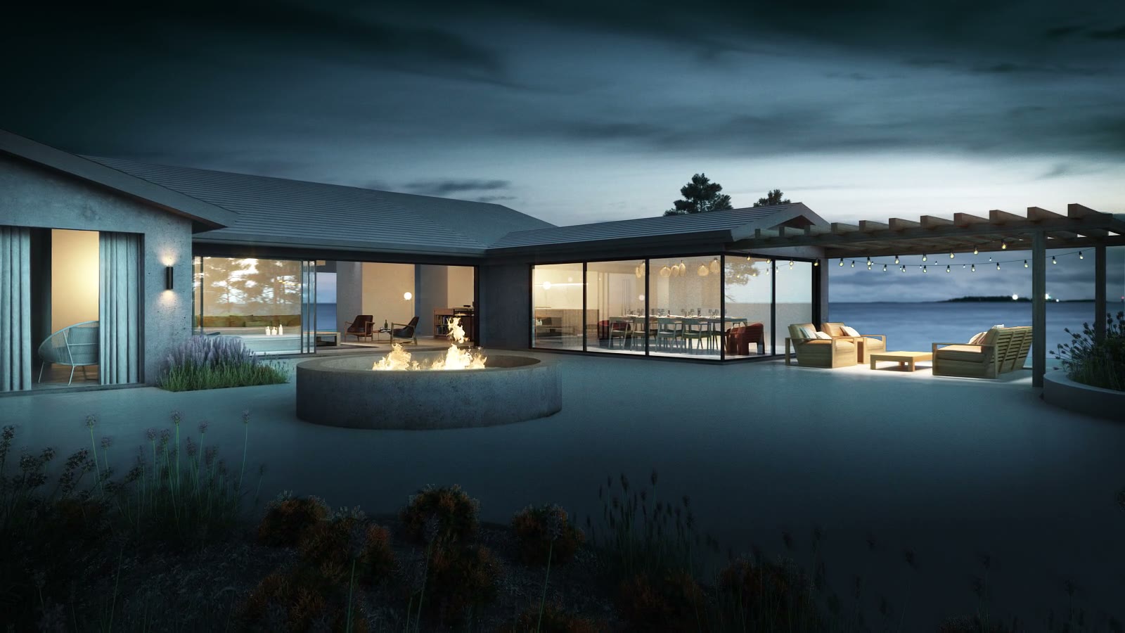 Still from a ranch house film: the terrace at dusk with a fire pit, lit interiors behind glass and the water beyond, animated by NoTriangle Studio.