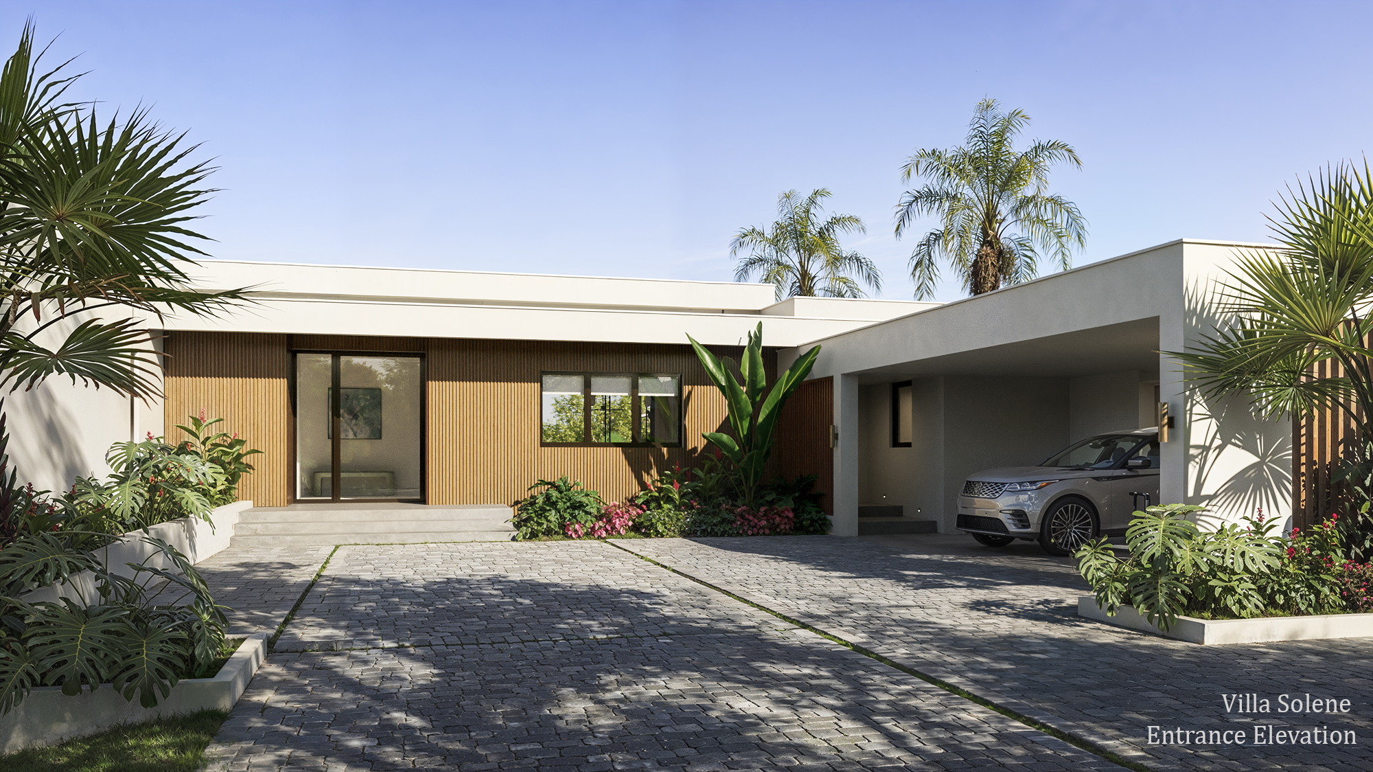 3D exterior rendering of the Villa Solene entrance elevation at Apes Hill, Barbados, showing the single-story home with vertical timber-slat cladding against white render, a glazed front door reached by low steps, a covered carport with a parked SUV, and a stone-paver driveway framed by palms and flowering tropical beds.