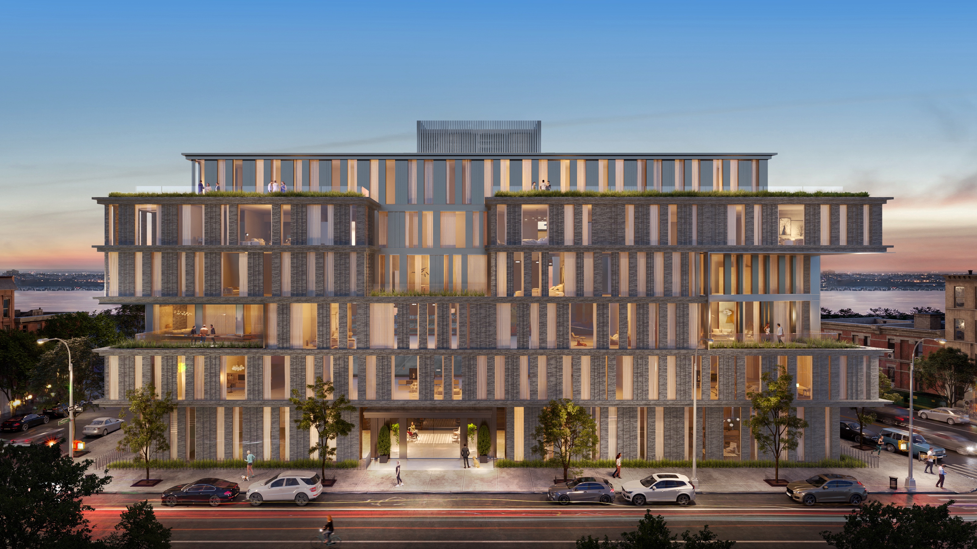 Sunset 3D rendering of the West Village concept's full street elevation, a brick facade carved into stepped, planted terraces with warmly lit apartments, the Hudson River visible at the ends of the block.