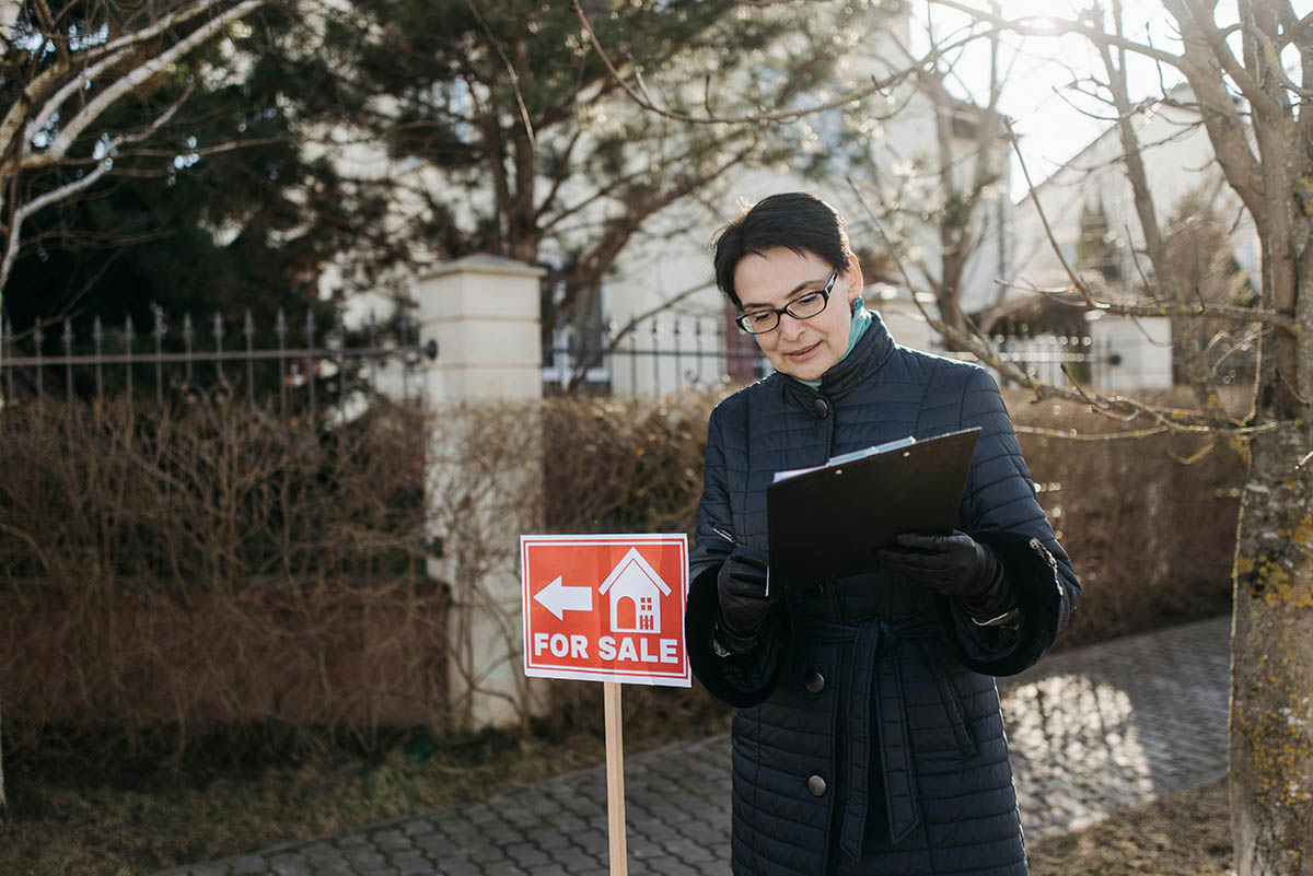 real estate agent for sale sign